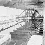 Black and white photograph of a railway mounted gantry spanning a boat testing tank