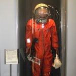 Colour photograph of Yuri Gagarins space suit on display in a glass cae