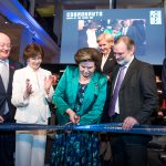 Colour photograph of the first woman in space cutting the ribbon at the opening of Cosmonauts exhibition in the presence of HE Ambassador Alexander Yakovenko Director of the Science Museum Group Mr Blatchford Chair of the SMG Dame Mary Archer Deputy Prime Minister of the Russian Federation Olga Golodets HE Ambassador Tim Barrow and the Group Chief Executive BP Bob Dudley