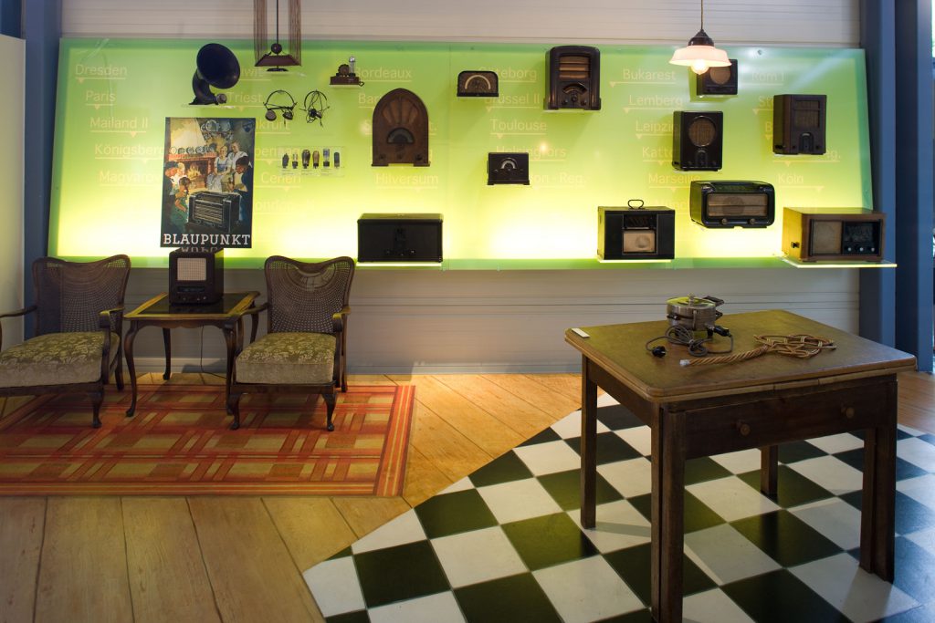 Museum display of historical furniture and wireless sets