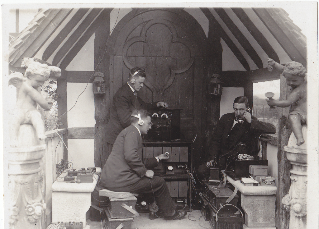 Black and white photograph of wireless engineers using early recording equipment in preparation for a recording at Foyle Riding