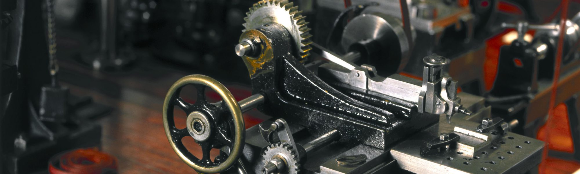Colour photograph of detail of a miniature machine workshop model from late 1800s on display in the Science Museum London