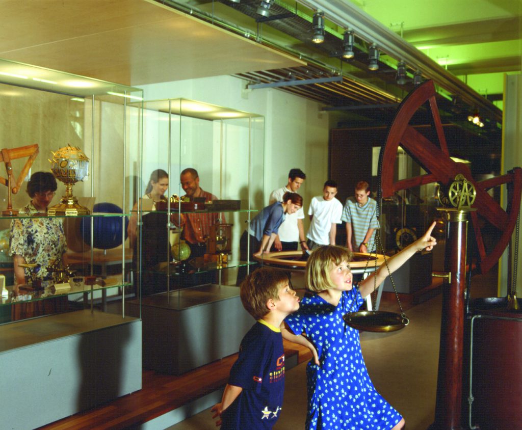 Colour photograph of museum goers at an exhibition about nature and knowledge