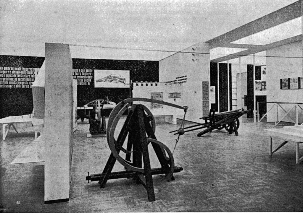 Grainy black and white photograph of a section of the 1939 Leonardo exhibition clearly showing the wooden sling model in the foreground