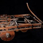 Colour photograph of a wooden model of a self propelled car