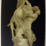 Cover of a museum brochure showing a carved statue of two lovers kissing