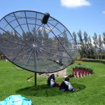 Two Ecuadorian women adapt technology to their own lives by creating a sunshade out of a satellite dish
