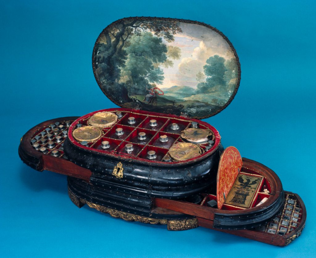 Colour photograph of an italian medicine chest from around 1560 with the lid and drawers open to show the original contents