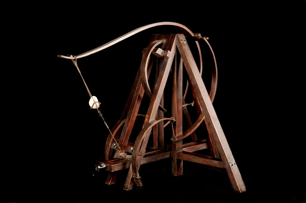 Colour photograph of a wooden model of a spring catapult