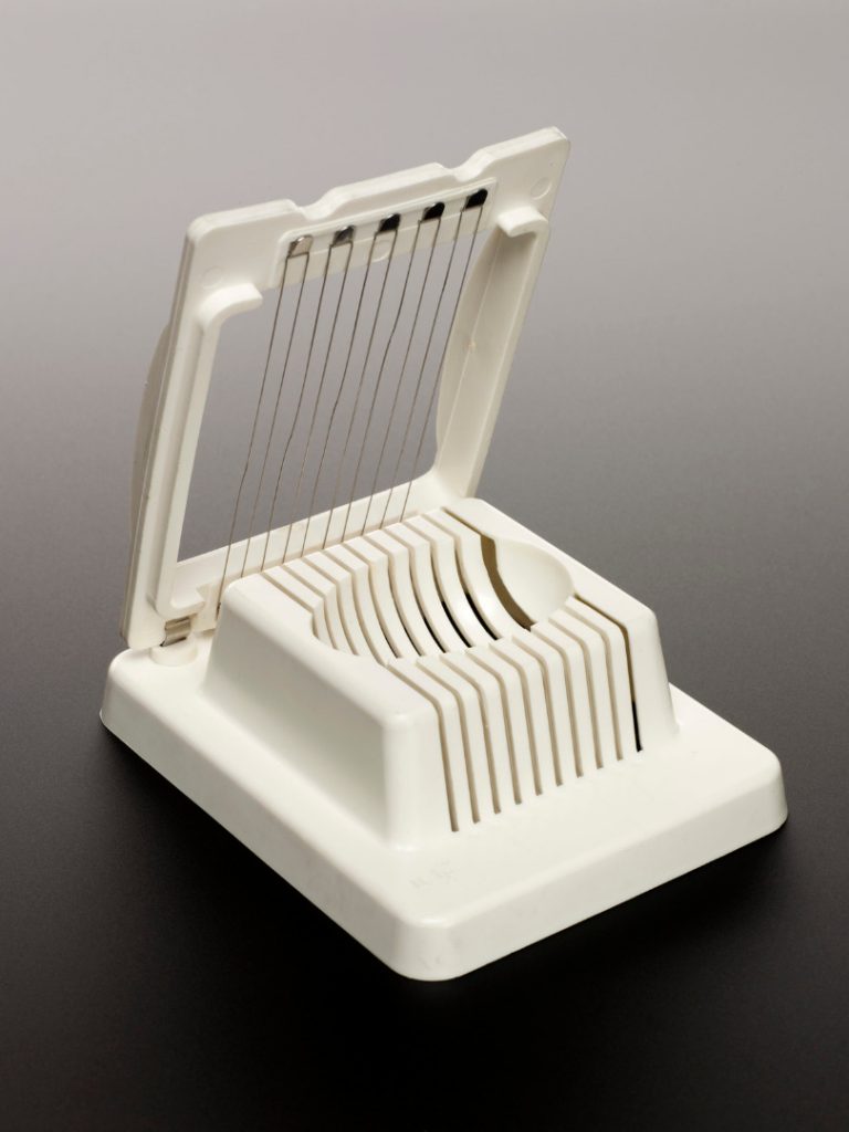 An egg slicer with steel slicing strings used with a contact microphone by electro-acoustic musician Hugh Davies