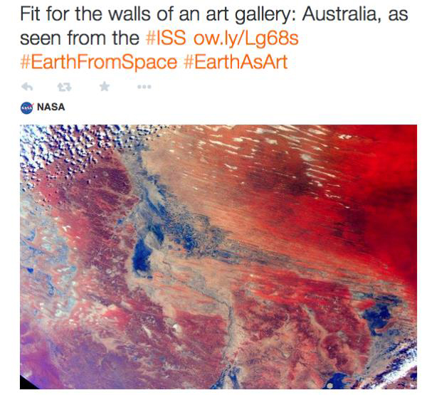 Tweet of a colour photograph of part of Australia taken from space with the text fit for the walls of an art gallery: Australia as seen from the ISS