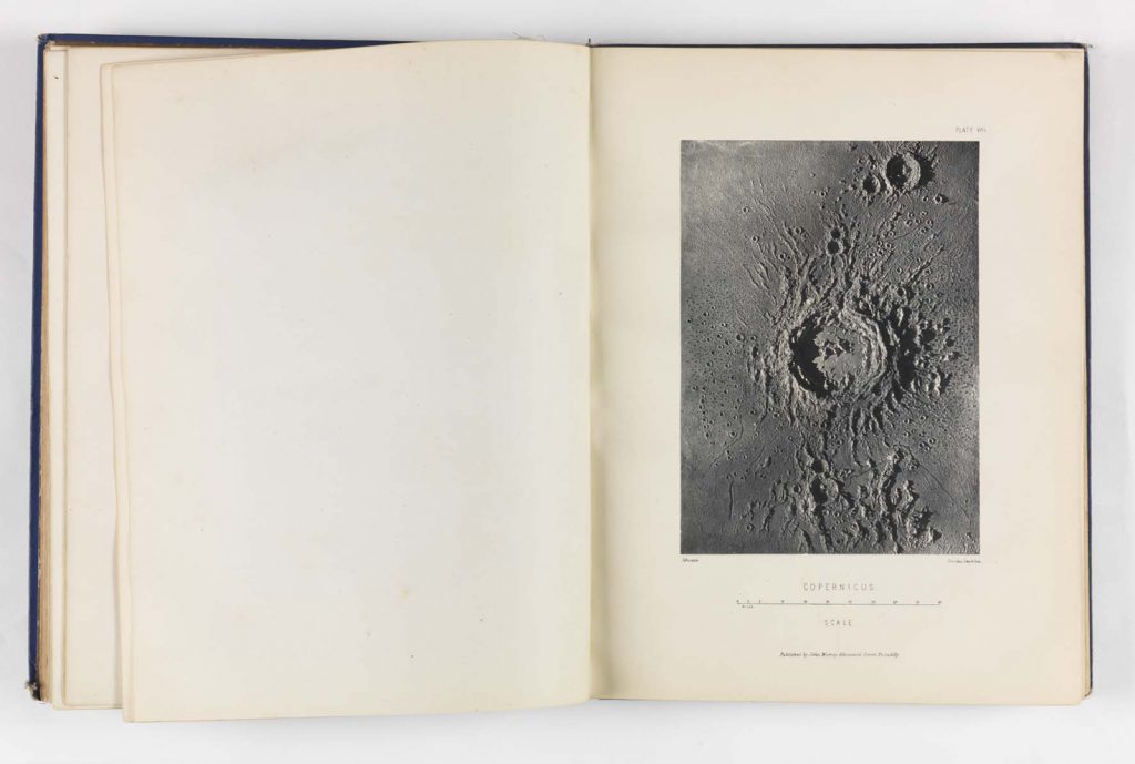 Top down photograph in a book of a plaster model of a crater entitled Copernicus