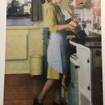 Page in a magazine showing a colour photograph of a woman cooking over a stove. The caption reads coal has yielded up its riches