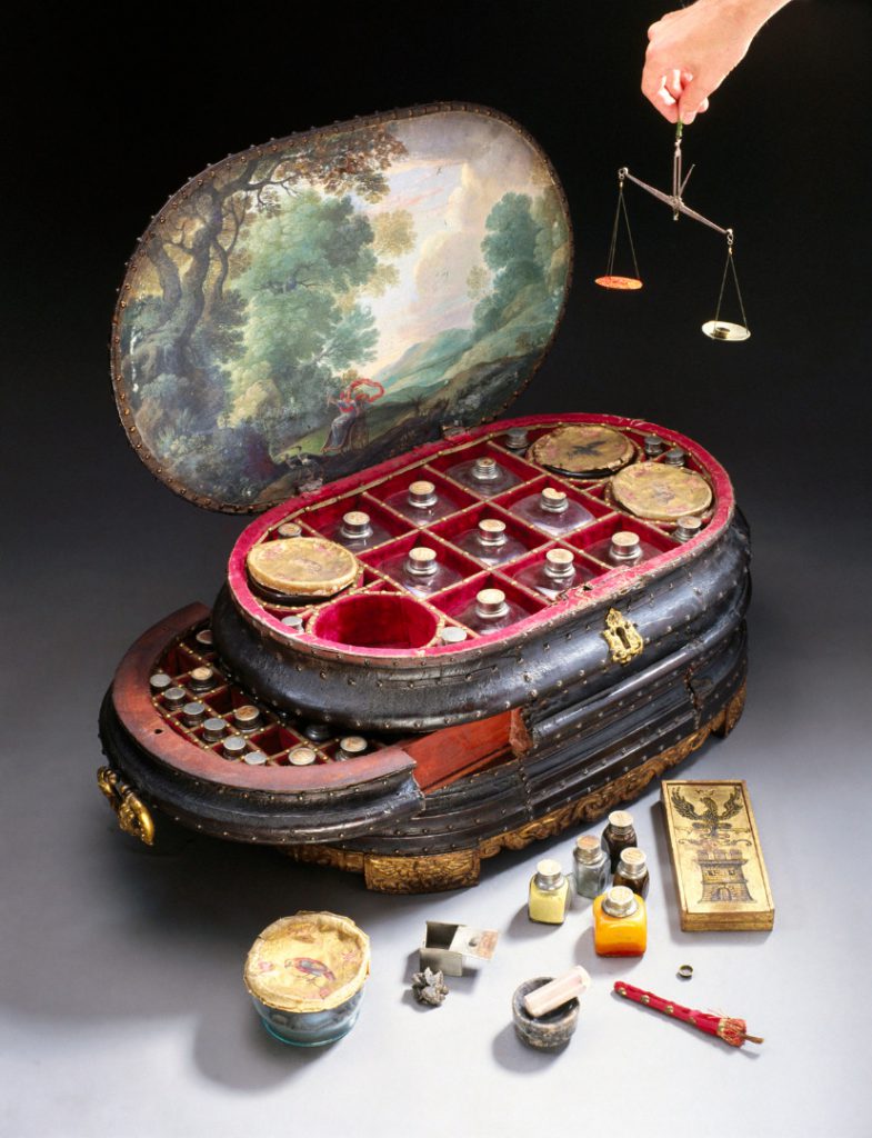 Colour photograph of an italian medicine chest from around 1560 with the lid and drawers open to show the original contents