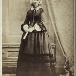 Black and white full figure portrait photograph of Florence Nightingale