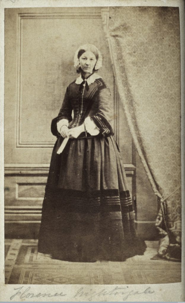 Black and white full figure portrait photograph of Florence Nightingale