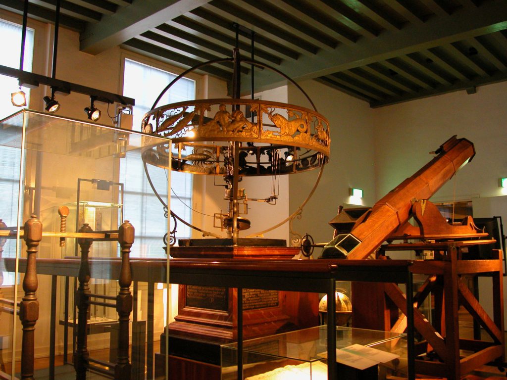 Colour photograph of a heliocentric planetarium from the Leiden onbservatory in storage at a museum