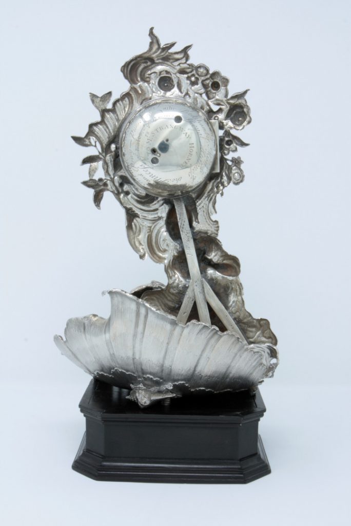 Photograph of the silver-cased clock, rear view