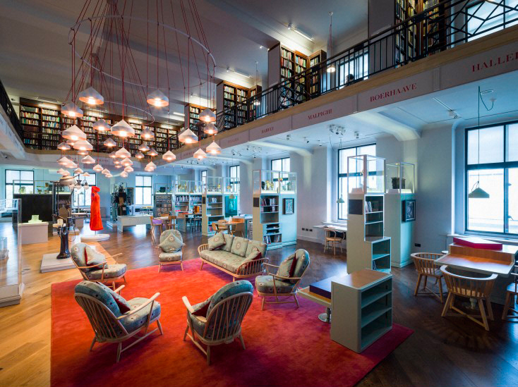 Colour photograph of the Wellcome Collections Reading Room which appears as a cross between a library and a museum gallery