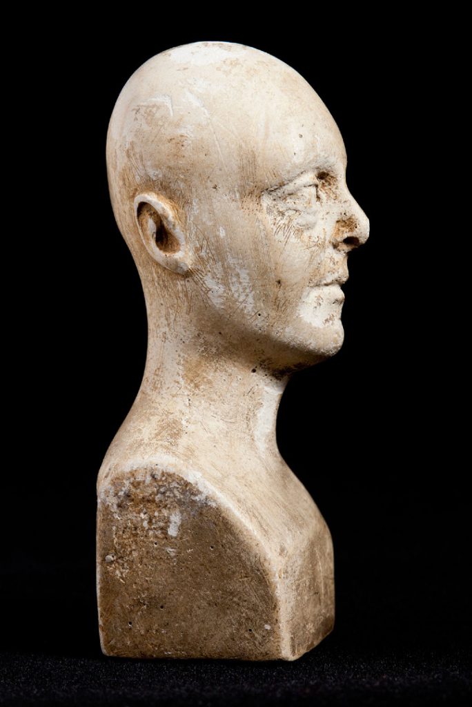 Side view of miniature phrenology bust showing brush marks