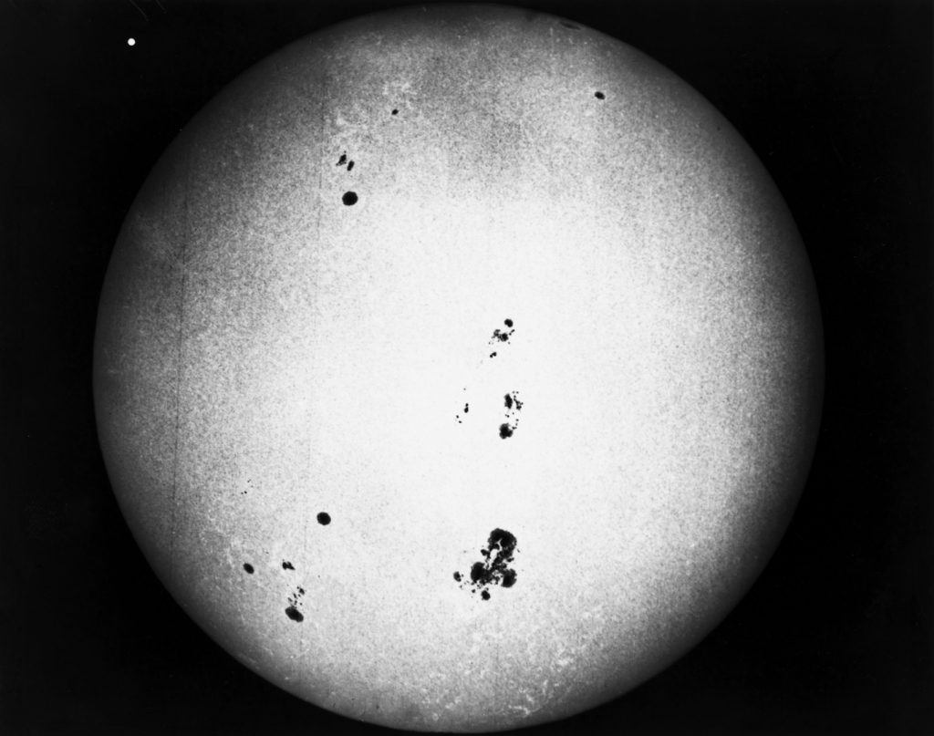 A black and white photograph from 1917 of the sun showing sunspots on the surface