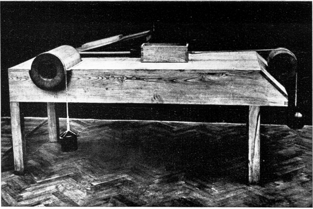 Black and white photograph of a wooden model of a design by Leonardo da vinci for testing friction