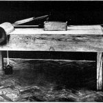 Black and white photograph of a wooden model of a design by Leonardo da vinci for testing friction