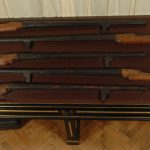 Museum table displaying five rifle style firearms from the seventeenth century