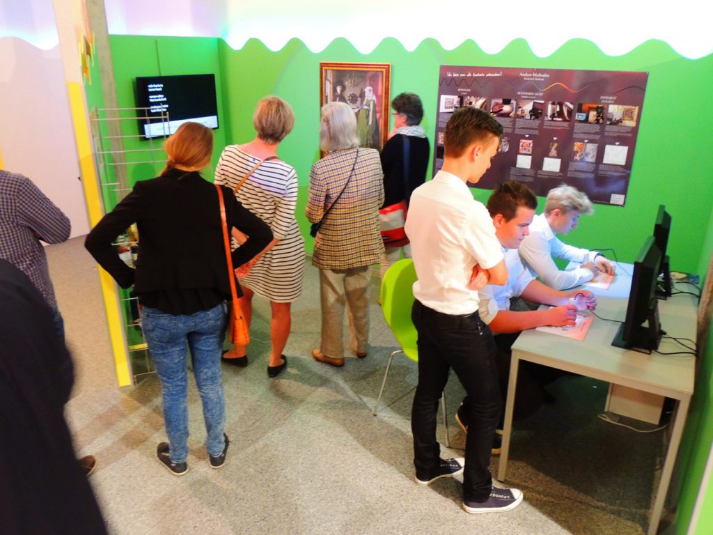 Colour photograph of museum goers at an exhibition about colour