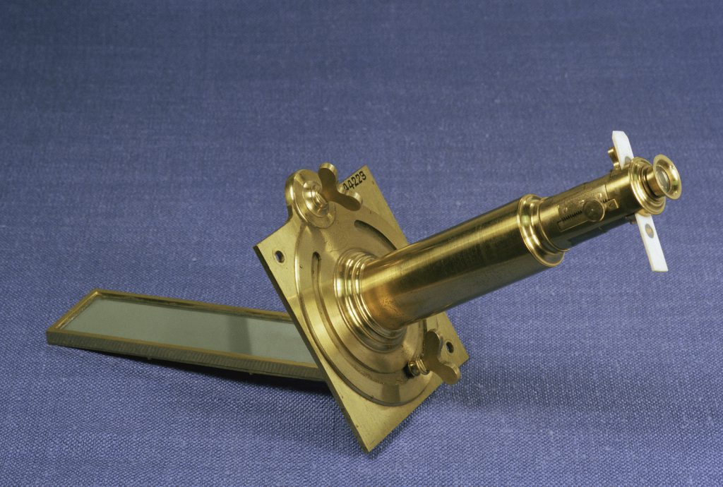 Colour photograph of a robustly made brass solar microscope