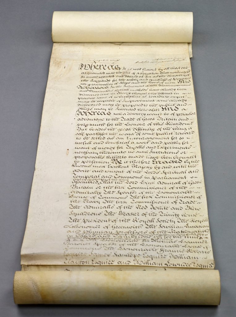 Old  legal document scroll showing calligraphic writing in old English