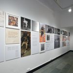 Colour photograph of a display wall in the Reconstructing Lives exhibition