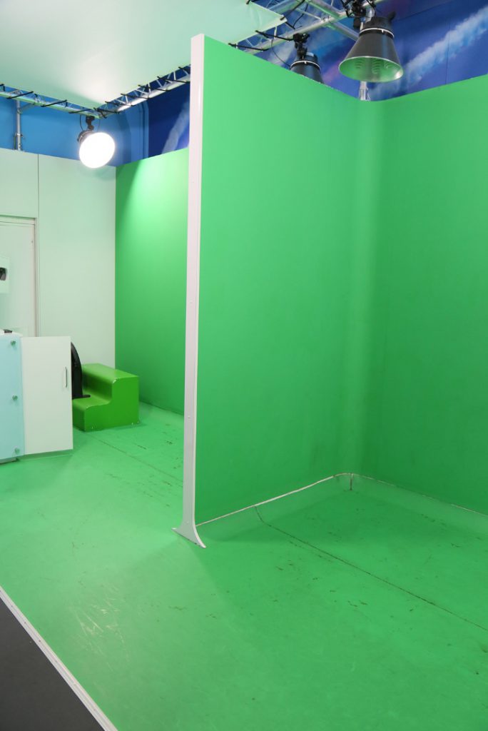 A green screen used for super imposition photography at the Flight Gallery photo studio