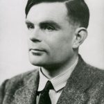 Black and white photograph portrait of Alan Turing looking to right of camera