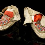 Colour photograph of a pair of aboriginal north american moccasins
