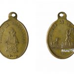 Colour photograph of the front and reverse sides of a coin amulet to protect against rabies