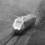 Black and white photograph of an advanced passenger train on tracks in the 1960s