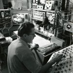 Black and white photograph of William Grey Walter and a 16 channel EEG