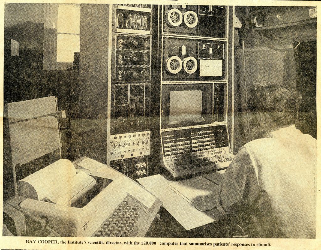 Newspaper clipping showing a scientist sitting before a computer from 1972