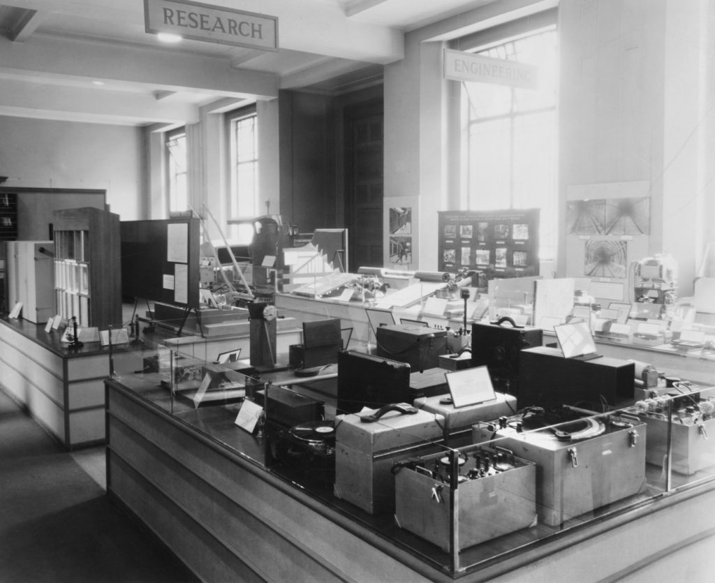 Black and white photograph showing a number of noise meters on display in the research section of an exhibition on noise at the Science Museum London