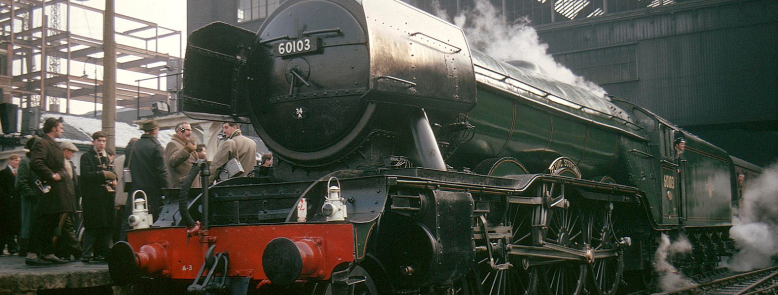 The Flying Scotsman steam train on the tracks at London Kings Cross station