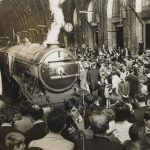 Black and white photograph of the Flying Scotsman steam train after restoration in London Kings Cross station in the 1960s