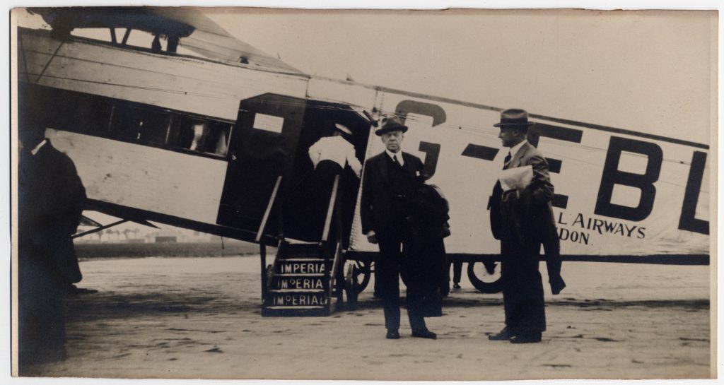 A 1930s black and white photograph showing two museum Directors at Paris airport