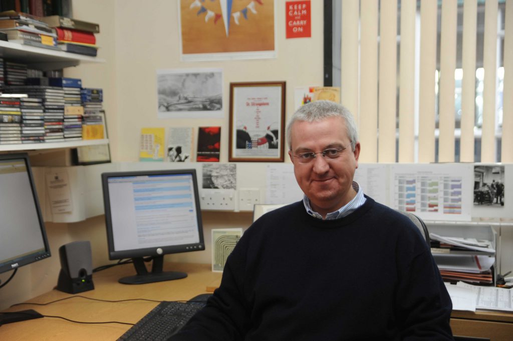 Colour photograph of Jeff Hughes in his office