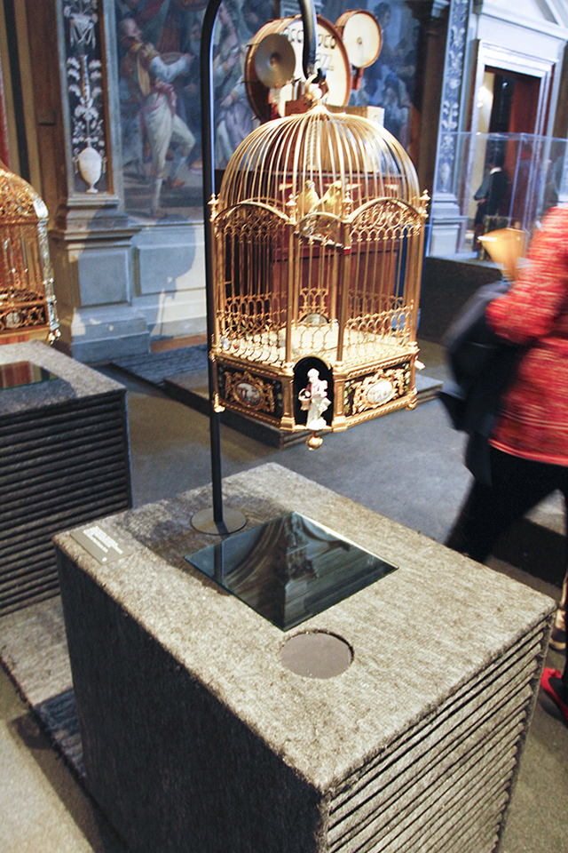 Colour photograph of a cuckoo clock installed as a listenable object in the Fondazione Prada museum in Venice