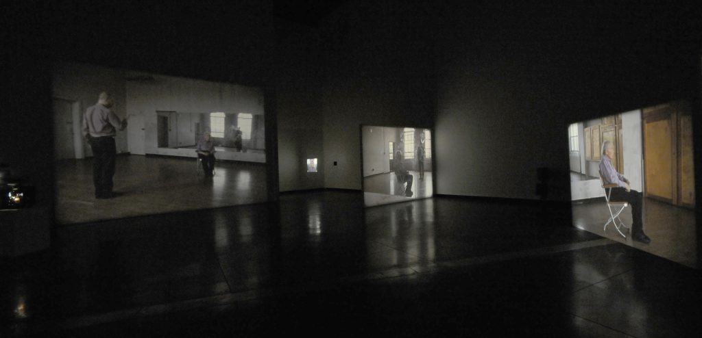 Colour photograph of a video installation within a gallery
