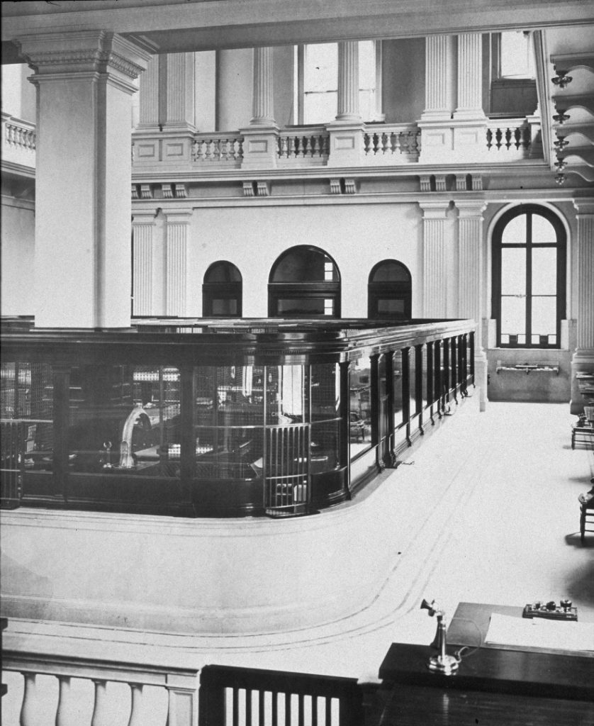 Black and white photograph of a floor of the First National Bank from around 1911