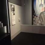 Colour photograph of a section of the Cosmonauts exhibition showing a painting of one of the Soviet designers