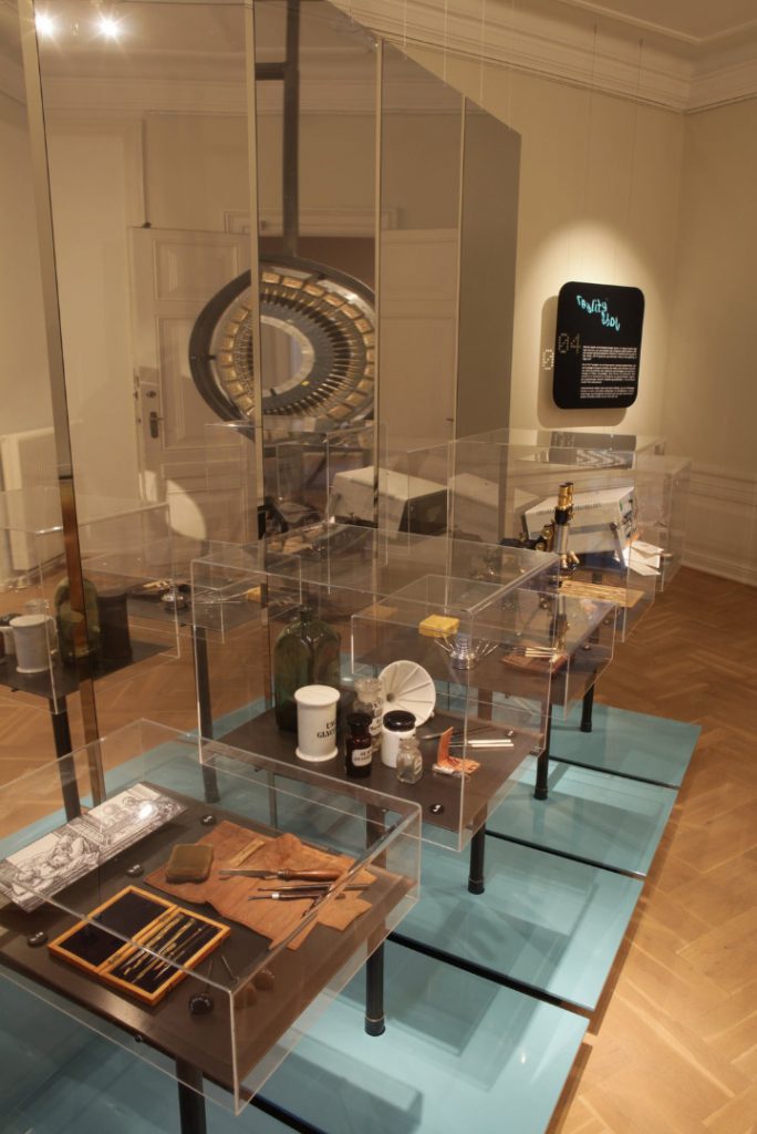 colour photograph of exhibition display cases showing various medical instruments old and new