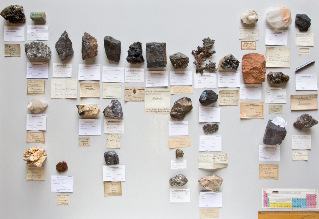 Colour photograph of a number of mineral samples of rock types that are used in modern consumer technologies